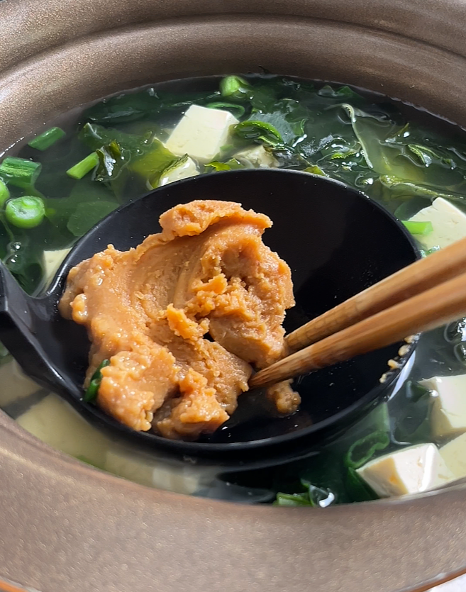 stirring miso into pot