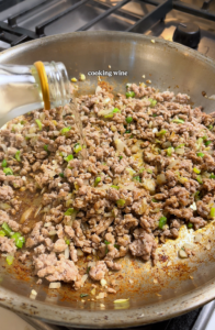 adding sauces to ground pork